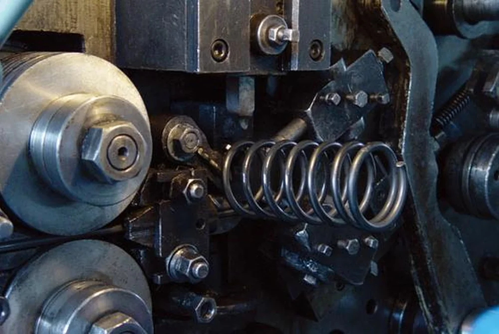 Compression spring manufacturing on spring coiling equipment