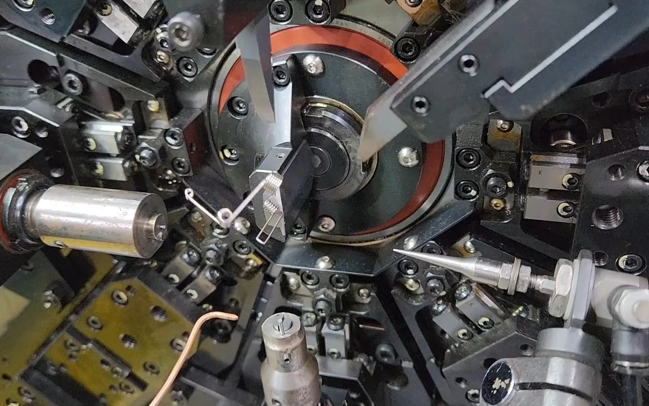 Custom spring wire forming on production equipment