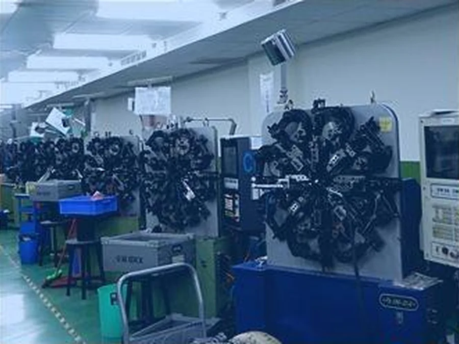 Spring production equipment on a manufacturing shop floor